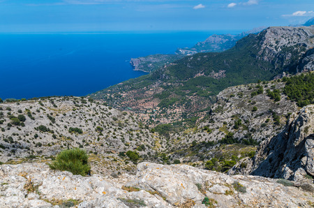 Panorama of Deia and the beautiful coastloine from the mountains of Tramuntana, Baleares, Spainの写真素材