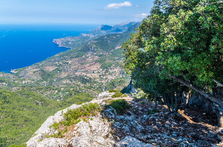 Panorama of Deia and the beautiful coastloine from the mountains of Tramuntana, Baleares, Spainの写真素材
