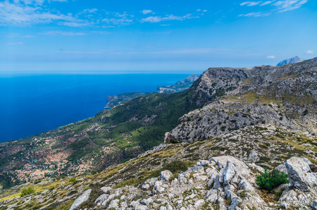 Panorama of Deia and the beautiful coastloine from the mountains of Tramuntana, Baleares, Spainの写真素材