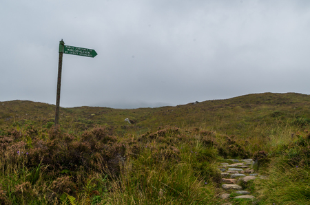 Signpost for hikers at Devil's Staircase in Glen Coe, Scotland, Great Britainの写真素材