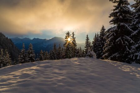 Winter scene with sunset in mountainsの写真素材