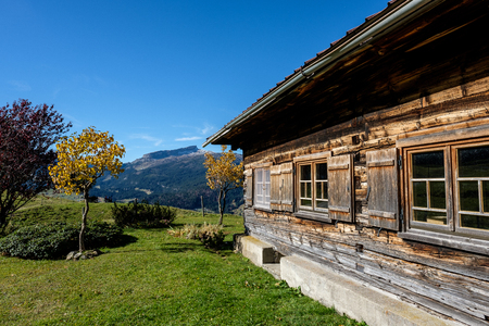 Romantic wooden mountain hut in Kleinwalsertal valley, Austriaの写真素材