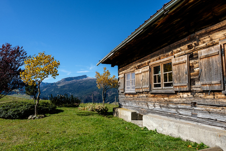 Romantic wooden mountain hut in Kleinwalsertal valley near Ifen, Austriaの写真素材