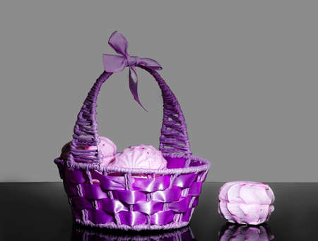 Purple basket with berry zephyr on a mirrored backgroundの写真素材