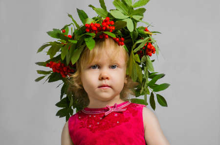 Little girl in a wreath Rowan in the studioの写真素材