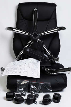 a complete set of components for assembly of an office chair on a white backgroundの写真素材