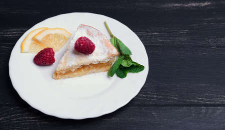 On the white porcelain plate , raspberry, mintの写真素材
