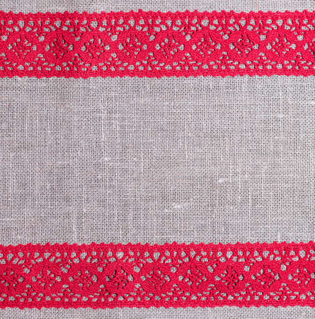 light gray fabric from flax coarse burlap candle with red lace handmadeの写真素材