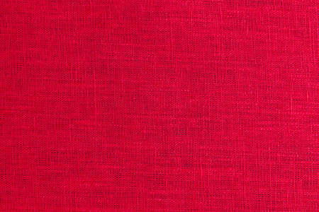 Red fabric closeup flax linen burlap textureの写真素材