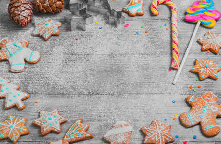 Christmas cookies, cones. New year gingerbread. Christmas card with empty space in middle of text greeting. Forms for Christmas cookies, candy cane.  Cooking Christmas cookies.の写真素材