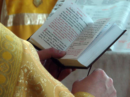 Slavic Gospel in hands of russian orthodox priest