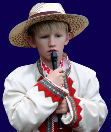    Boy folk musician with Ukrainian instrument sopilkaの写真素材