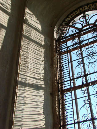 Window of ancient cathedral through which light is passing