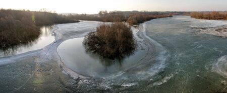Panorama of frozen wide riversideの写真素材