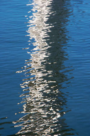 textured rippled color water surface with  abstract reflectionの写真素材