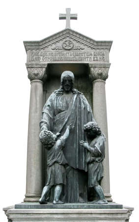 Mature tombstone sculpture of Jesus Christ with children の写真素材