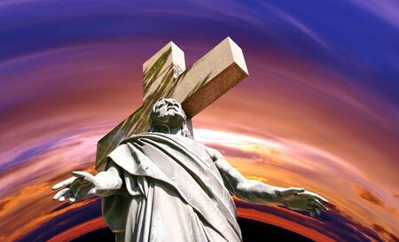 marble Holy cross with crucified Jesus Christ against dramatic sunsetの写真素材