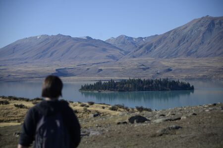 Mountains and lake landscape scene in Lake tekapoの写真素材
