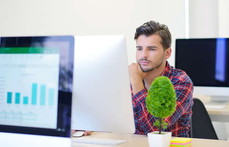 startup business, software developer working on computer at modern officeの写真素材