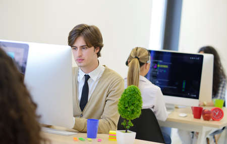 startup business, software developer working on computer at modern office