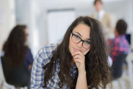 group of young business people having fun, relaxing and working in creative room space at modern startup officeの写真素材