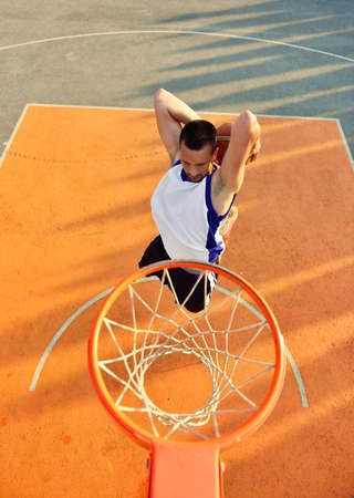 View of flying ball to basket from top. Face gesture