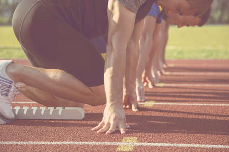 Male athletes at starting line.の写真素材