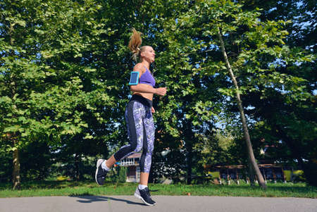Two woman practicing working out - fitness outdoor at the park.