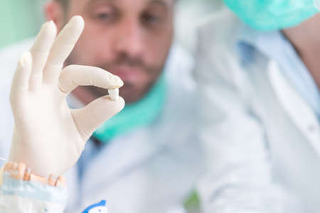 Closeup of dentistry student practicing on a medical mannequin