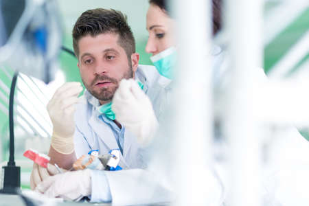 Closeup of dentistry student practicing on a medical mannequin