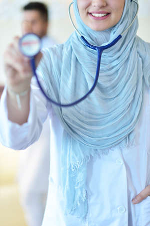Closeup portrait of friendly, smiling confident muslim female doctorの写真素材