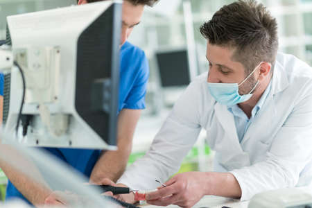 Dental prosthesis, dentures, prosthetics work. Dental students while working on the denture, false...