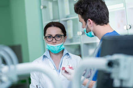 Dental prosthesis, dentures, prosthetics work. Prosthetics hands while working on the denture, false...