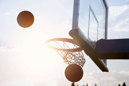 Basketball going through the basketの写真素材