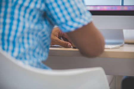 Male hands or men office worker typing on the keyboardの写真素材