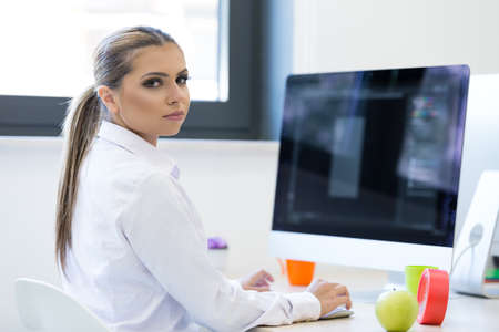 Woman working at computer in an office