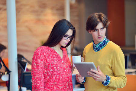 Young adults in training course using touchpadの写真素材