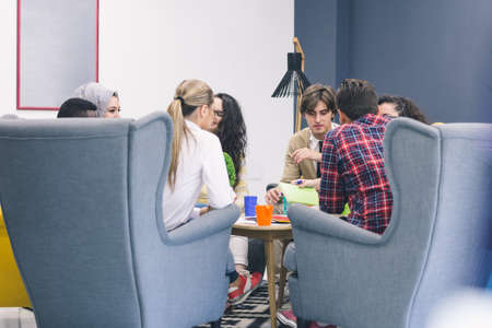 Shot of a group of young business professionals having a meeting. Diverse group of young designers...