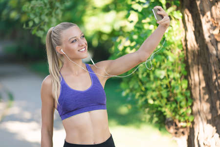 healthy lifestyle fitness sporty woman running early in the morning in forest area, healthy...
