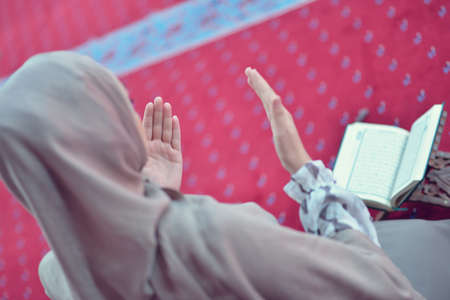Young muslim woman praying alone in mosqueの写真素材