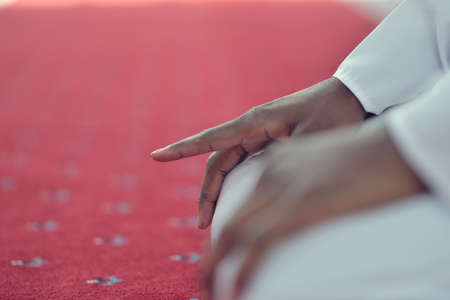 African Muslim Man Making Traditional Praying To God While Wearing A Traditional Cap Dishdasha