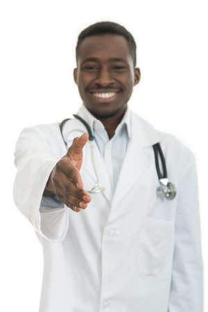 Closeup portrait smiling black healthcare professional, male doctor with stethoscope, giving handshakeの写真素材