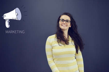 Pretty young woman in front of stock market graphs and symbols.の写真素材