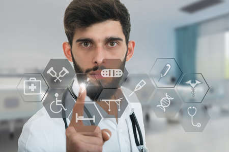 A close-up portrait of a rude, frustrated, upset doctor isolated on a white background. Medical symbolsの写真素材
