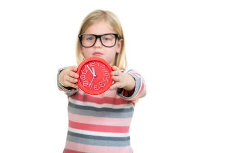 Cute girl wearing glasses with clock isolated over white.の写真素材