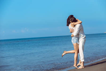 romance on vacation: couple in love on the beach flirtingの写真素材