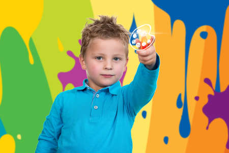 3 years old child point orange penの写真素材