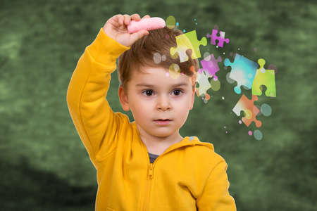 little kid about to draw something with chalkの写真素材