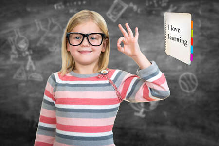 Back to school - happy kid with books and letters, isolated