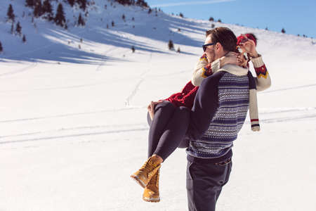 Happy Couple Having Fun on snow mountain.の写真素材